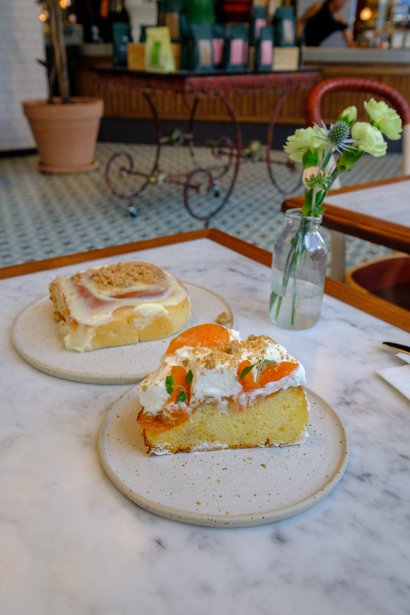 Cinnamon bun and elderflower-apricot cake